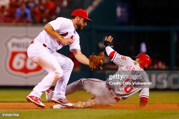 Cesar Hernandez of the the Philadelphia Phillies steals second base against Paul DeJong of the St. Louis Cardinals at Busch Stadium on May 17, 2018...