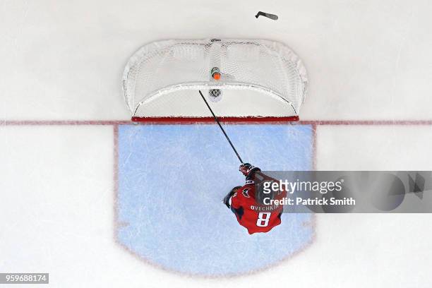 Alex Ovechkin of the Washington Capitals breaks his stick over the crossbar of the goal after Tampa Bay Lightning scored an empty net goal during the...