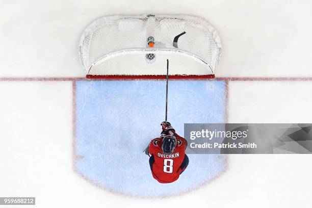 Alex Ovechkin of the Washington Capitals breaks his stick over the crossbar of the goal after Tampa Bay Lightning scored an empty net goal during the...