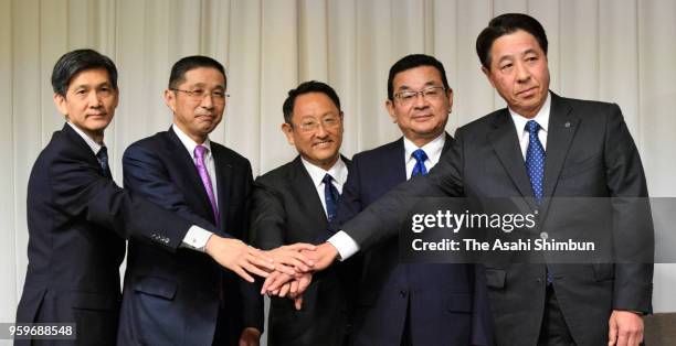 Japan Automobile Manufacturers Association President Seiichi Nagatsuka, Nissan Motor Co President Hiroto Saikawa, Toyota Motor Co President Akio...