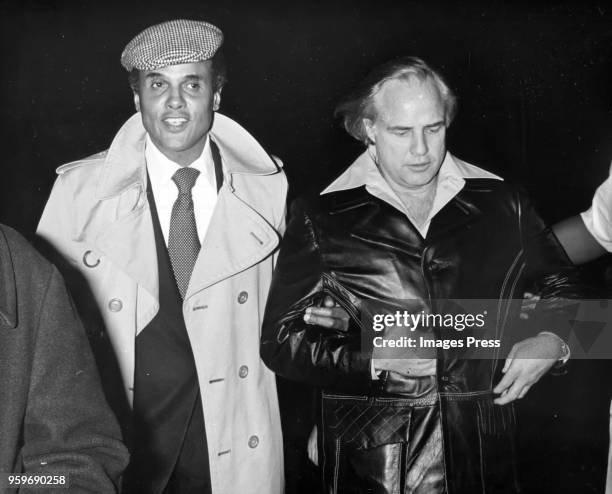Marlon Brando and Harry Belafonte pictured at the Apollo theater on March 11, 1974 in New York City.