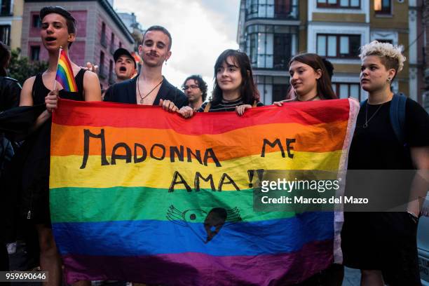 People protesting during the International Day Against Homophobia, Transphobia and Biphobia to demand equality for LGBT community. In the flag the...