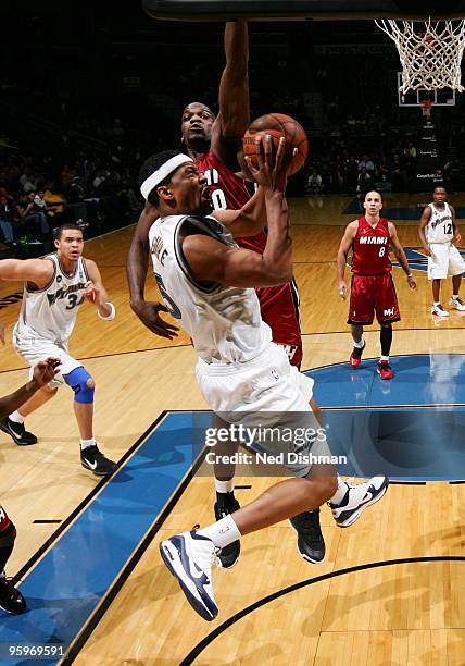 Dominic McGuire of the Washington WIzards shoots against Joel Anthony of the Miami Heat at the Verizon Center on January 22, 2010 in Washington, DC....