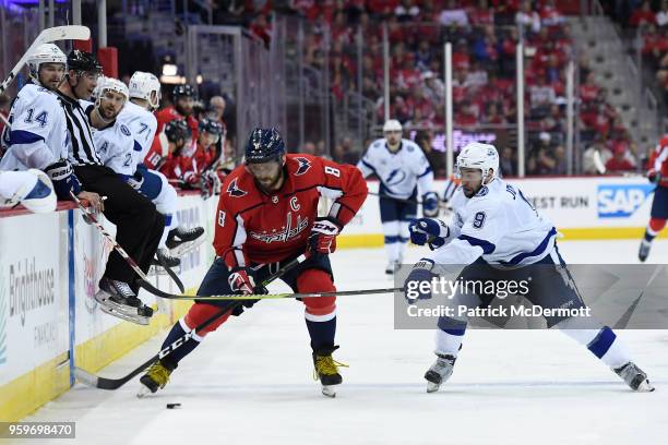 Alex Ovechkin of the Washington Capitals and Tyler Johnson of the Tampa Bay Lightning battle for the puck in the third period in Game Three of the...