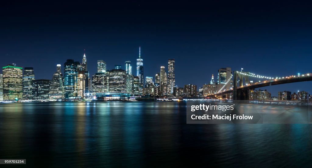 Manhattan panorama by night view from Brooklyn Bridge Park