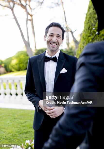 Adrien Brody attends the cocktail at the amfAR Gala Cannes 2018 at Hotel du Cap-Eden-Roc on May 17, 2018 in Cap d'Antibes, France.