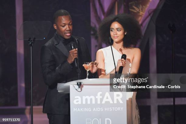 Corey Hawkins and Nathalie Emmanuel on stage at the amfAR Gala Cannes 2018 at Hotel du Cap-Eden-Roc on May 17, 2018 in Cap d'Antibes, France.