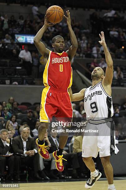 Guard Aaron Brooks of the Houston Rockets takes a shot against Tony Parker of the San Antonio Spurs at AT&T Center on January 22, 2010 in San...