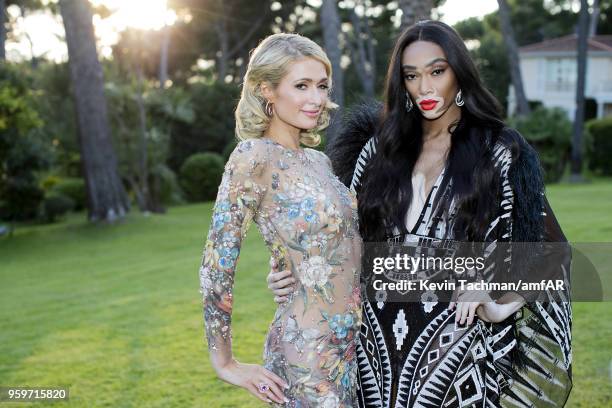 Paris Hilton and Winnie Harlow attend the cocktail at the amfAR Gala Cannes 2018 at Hotel du Cap-Eden-Roc on May 17, 2018 in Cap d'Antibes, France.
