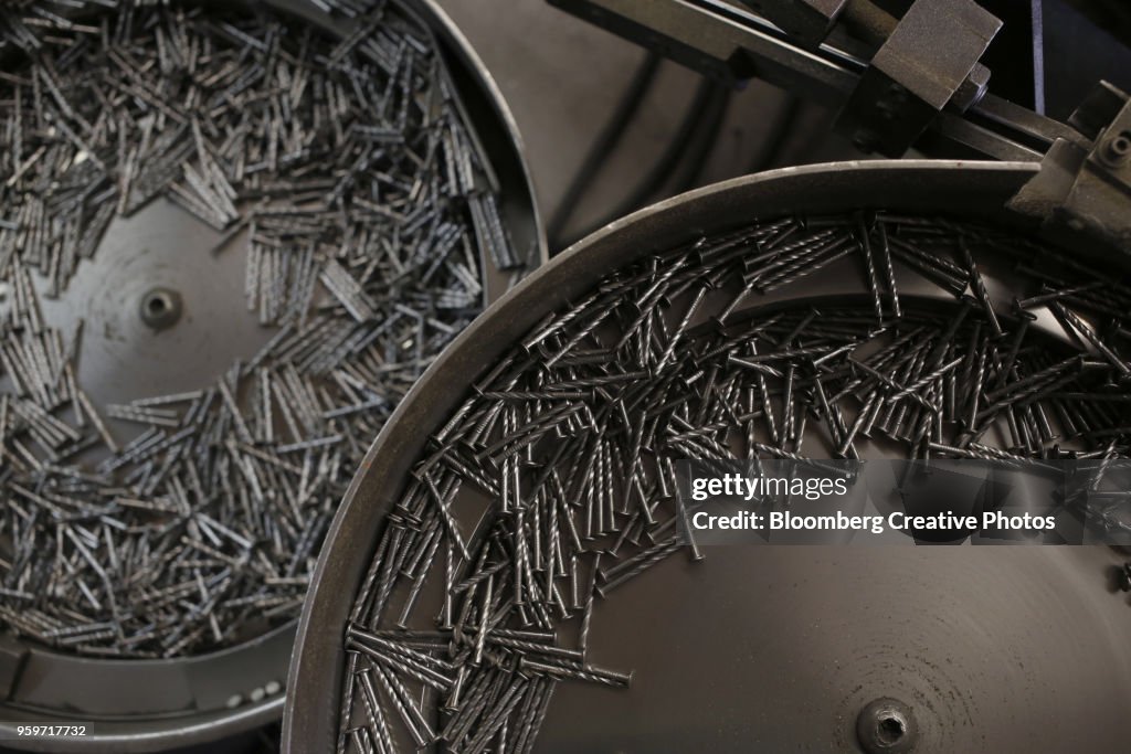 Nails sit in trays at a facility