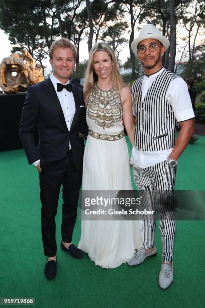 Nico Rosberg and his wife Vivian Rosberg and Lewis Hamilton during the cocktail at the amfAR Gala Cannes 2018 at Hotel du Cap-Eden-Roc on May 17,...