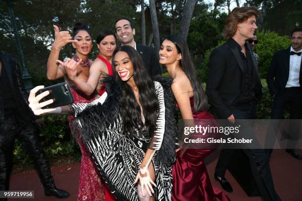 Nicole Scherzinger, Michelle Rodriguez, Mohammed al Turki, Winnie Harlow takes a selfie during the cocktail at the amfAR Gala Cannes 2018 at Hotel du...