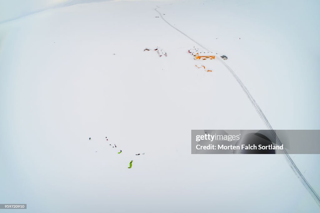 Aerial Shot of Kiteskiers in the Snow-Covered Hardangervidda National Park, Norway Wintertime