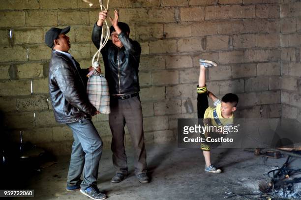Xiaburihai, a seven year old boy pratices Kung Fu at home in the liangshan yi autonomous prefecture of China's Sichuan province, 23 February 2018....
