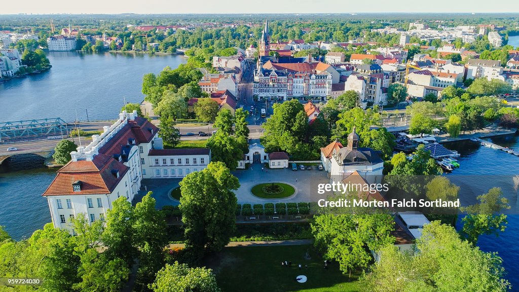 Aerial Drone Shot of a Wedding Party Standing in the Grounds of a Picturesque Building in Berlin, Germany Summertime