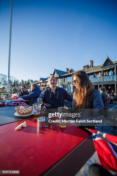 people eat and drink outside during the annual cross-country skifest in holmenkollen, norway springtime - skifest stock pictures, royalty-free photos & images