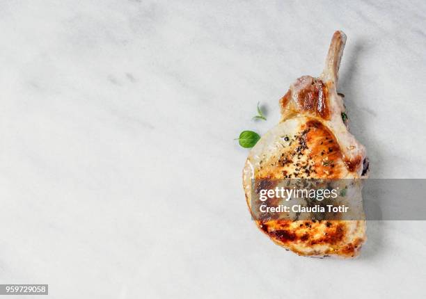 roasted pork chop - roast pig stock pictures, royalty-free photos & images