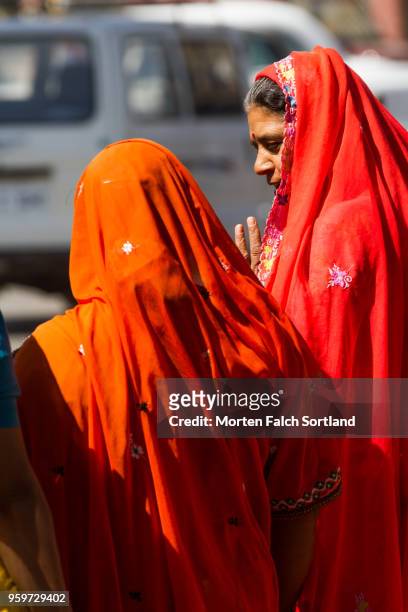 candid shot of local women on the streets of barla chora, india wintertime - ajmer stock pictures, royalty-free photos & images