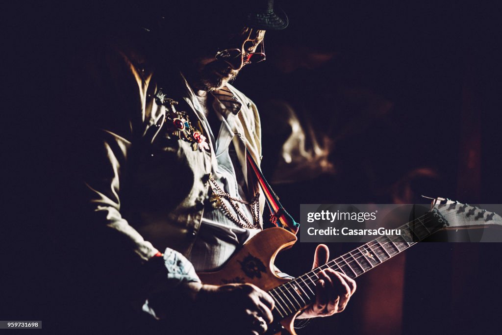 Senior Rock Guitarist Performing