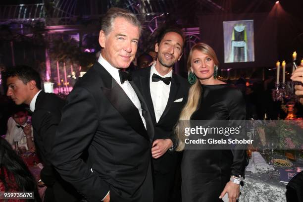 Pierce Brosnan, Adrien Brody and buyer of the painting attend the amfAR Gala Cannes 2018 dinner at Hotel du Cap-Eden-Roc on May 17, 2018 in Cap...