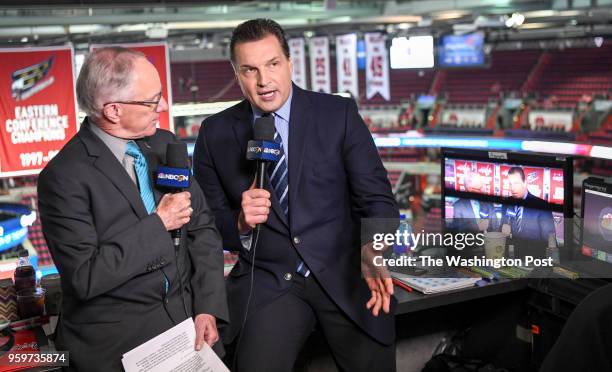 Hockey commentator Eddie Olczyk talks with Michael "Doc" Emrick as they do the pregame prior to action between the Tampa Bay Lightning and the...