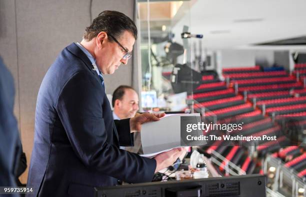 Hockey commentator Eddie Olczyk prepares his pregame notes prior to action between the Tampa Bay Lightning and the Washington Capitals during the...