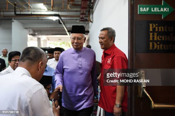 Malaysia's former prime minister Najib Razak arrives for Friday prayers at the Barisan Nasional party headquarters in Kuala Lumpur on May 18, 2018. -...