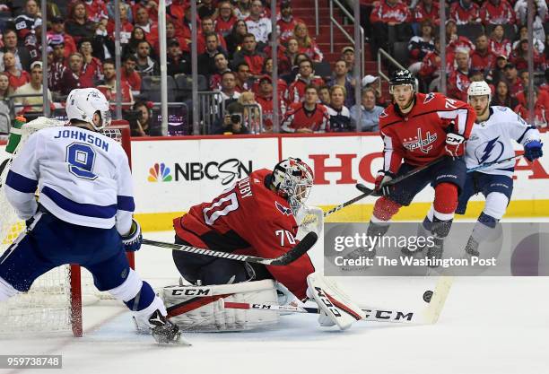 Washington Capitals goaltender Braden Holtby saves a shot Tampa Bay Lightning center Tyler Johnson during the second period of Game 4 of the Eastern...