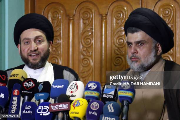 Iraqi Shiite Muslim leader and head of Hikma party Ammar al-Hakim and Shiite cleric Moqtada Sadr speak to the media during a meeting in the Iraqi...