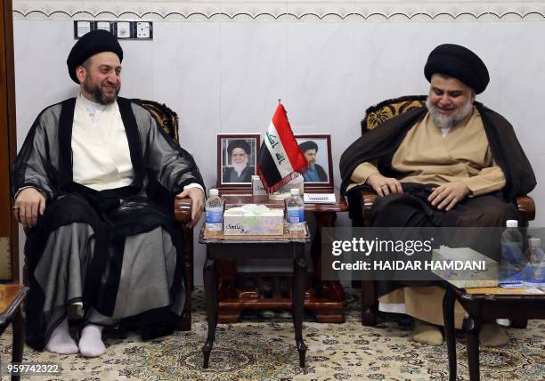 Iraqi Shiite Muslim leader and head of Hikma party Ammar al-Hakim and Shiite cleric Moqtada Sadr meet in the Iraqi holy city of Najaf on May 17,...