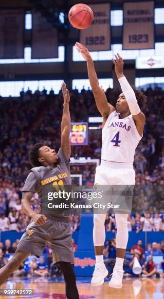 Arizona State Sun Devils guard Shannon Evans II defends a three-pointer by Kansas Jayhawks guard Devonte' Graham in the first half on Sunday, Dec....