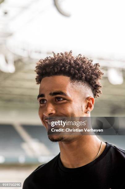 Keanan Bennetts pose after he signs a new contract for Borussia Moenchengladbach at Borussia-Park on May 18, 2018 in Moenchengladbach, Germany.