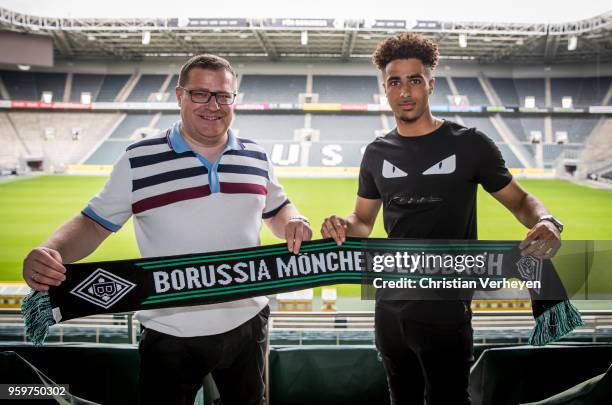 Director of Sport Max Eberl of Borussia Moenchengladbach pose with Keanan Bennetts after he signs a new contract for Borussia Moenchengladbach at...