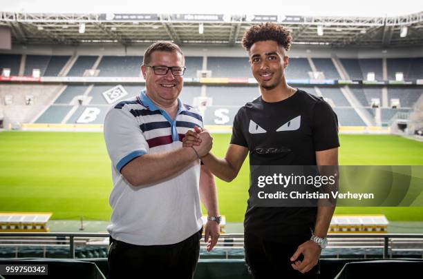 Director of Sport Max Eberl of Borussia Moenchengladbach pose with Keanan Bennetts after he signs a new contract for Borussia Moenchengladbach at...
