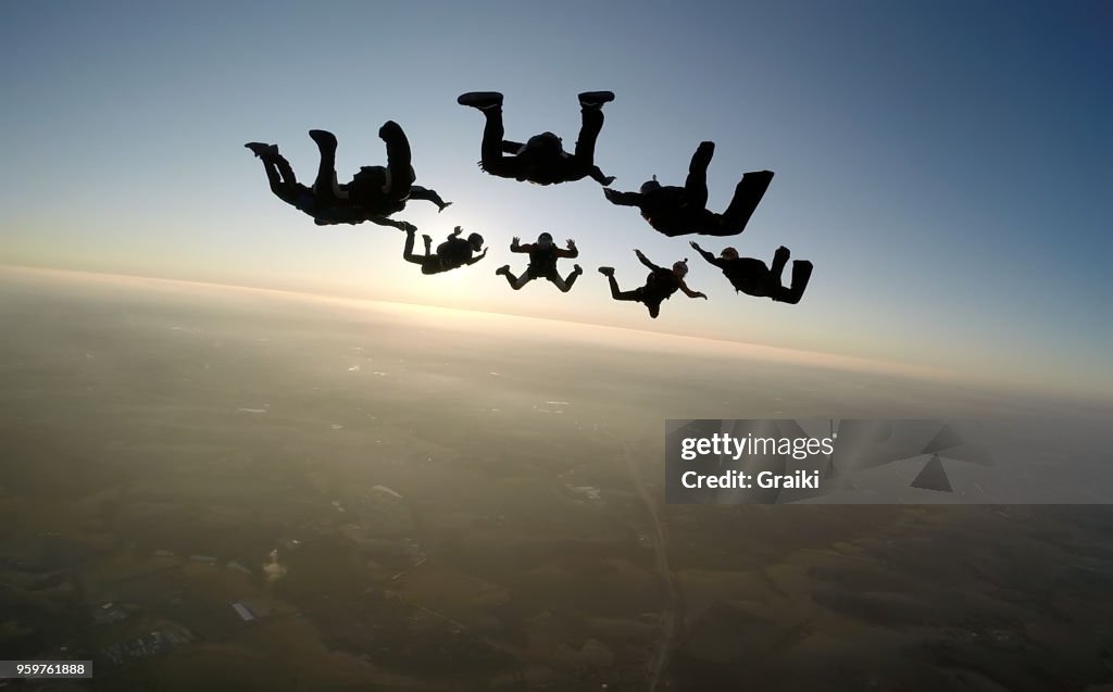 Skydiving group at the sunset