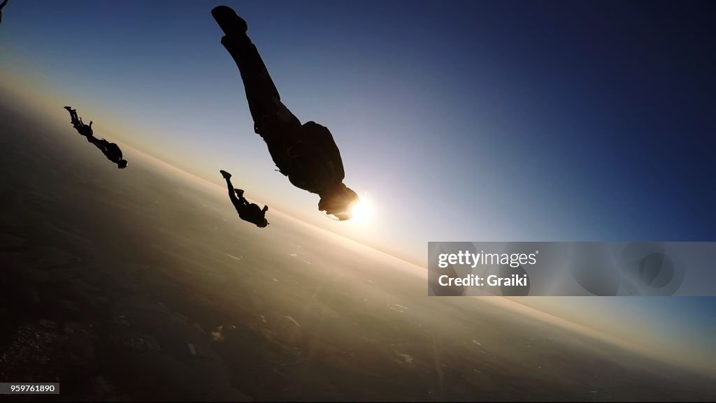 Skydiving group at the sunset