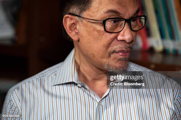 Anwar Ibrahim, founder of the People's Justice Party, listens during a Bloomberg Television interview in Kuala Lumpur, Malaysia, on Friday, May 18,...