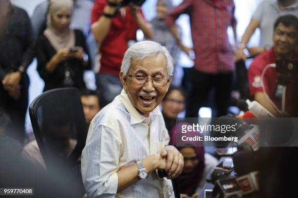 Daim Zainuddin, member of Prime Minister Mahathir Mohamad's advisory council, laughs during a news conference in Kuala Lumpur, Malaysia, on Friday,...