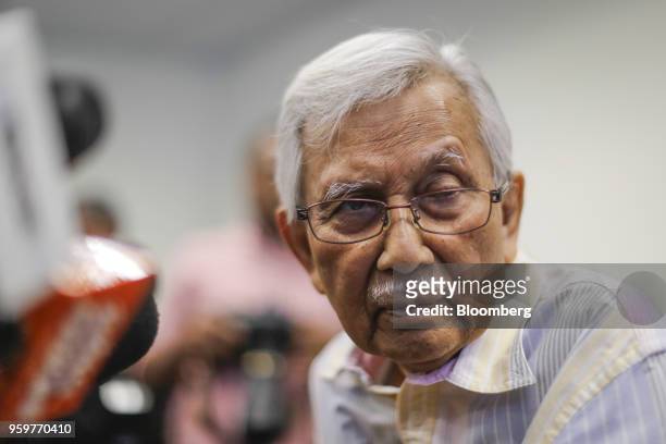 Daim Zainuddin, member of Prime Minister Mahathir Mohamad's advisory council, listens to a question during a news conference in Kuala Lumpur,...