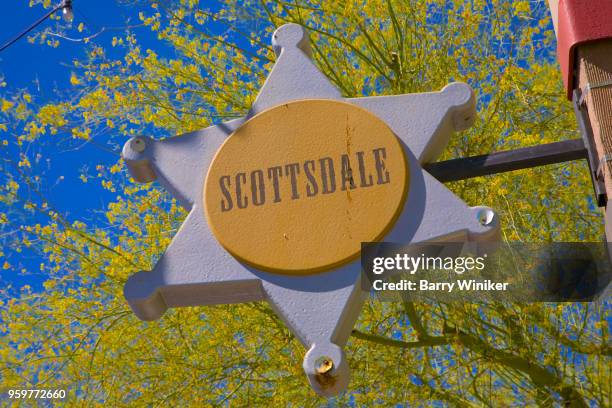 fun sign with city name in center of badge in old town scottsdale, az - old town scottsdale stock pictures, royalty-free photos & images