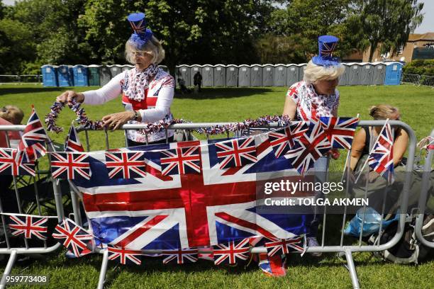 Royal fans, wearing the colours of the Union flag, set up their viewing position along the Long Walk in Windsor on May 18 the day before the Royal...