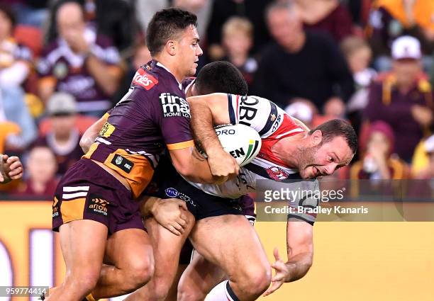 Boyd Cordner of the Roosters is tackled during the round 11 NRL match between the Brisbane Broncos and the Sydney Roosters at Suncorp Stadium on May...