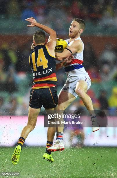 Lachie Hunter of the Bulldogs marks in front of David Mackay of the Adelaide Crows during the round nine AFL match between the Adelaide Crows and the...