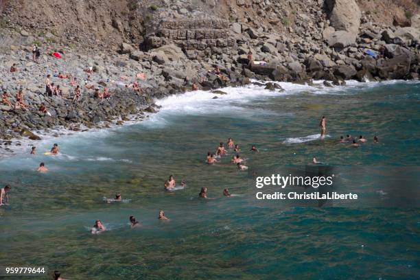 a section of rocky seaside at cinque terre "five lands", on the rugged ligurian coast of italy. - ligurian stock pictures, royalty-free photos & images