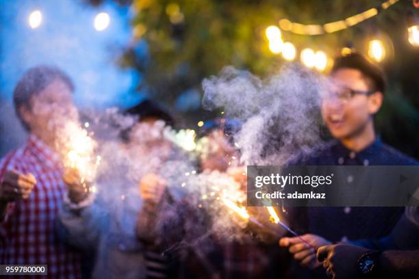 family and friends with sparklers - food safety at home stock pictures, royalty-free photos & images