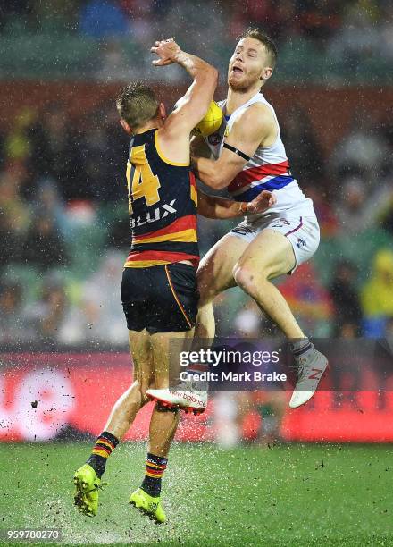 Lachie Hunter of the Bulldogs marks in front of David Mackay of the Adelaide Crows during the round nine AFL match between the Adelaide Crows and the...