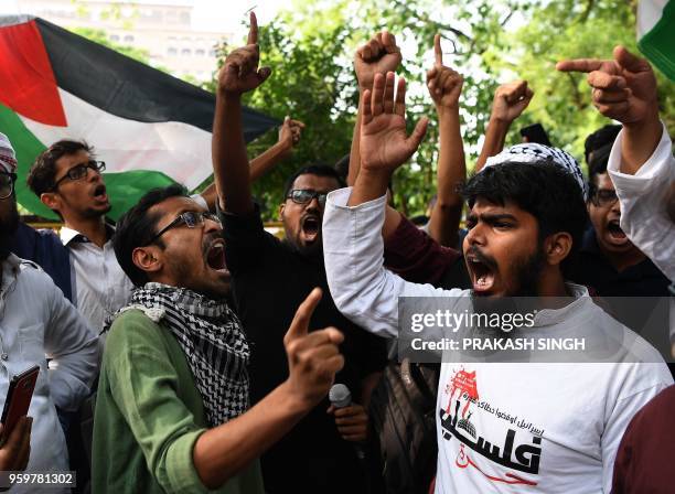 Indian Muslims, social activists and students shout slogans against Israel during a demonstration in New Delhi on May 18, 2018. - Protests have been...