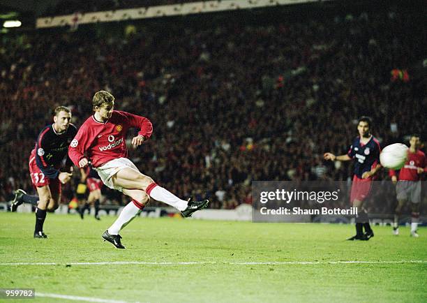 Ole Gunnar Solskjaer of Manchester United scores the opening goal of the match during the UEFA Champions League Group G match against Olympiakos...