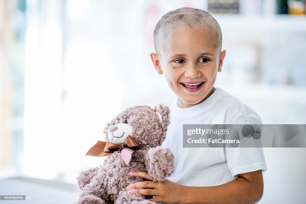 Boy Holding Teddy Bear