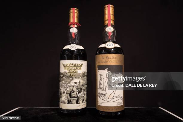 Two bottles of whisky, Macallan Peter Blake 1926 and Valerio Adami 1926 , are displayed ahead of a Bonhams auction in Hong Kong on May 18, 2018. -...